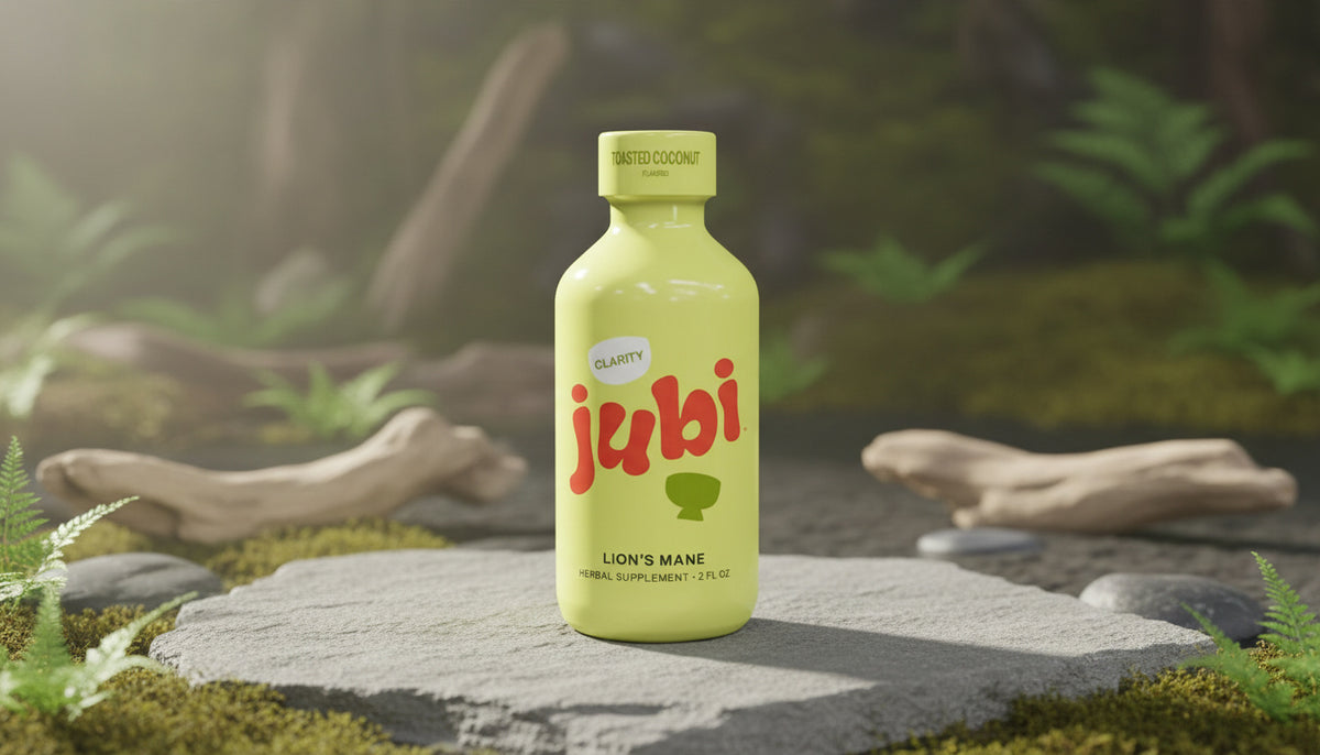 Lion’s Mane drink bottle displayed with natural textures and greenery